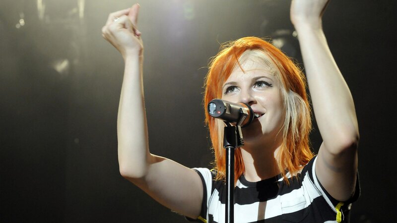 woman singing on stage