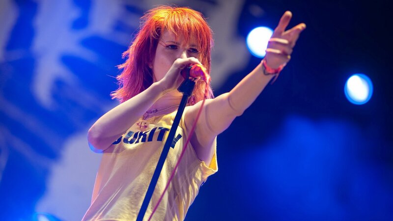 woman singing on stage