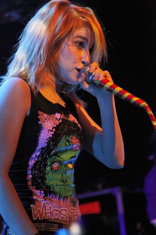 woman singing on stage