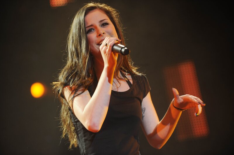woman singing on stage