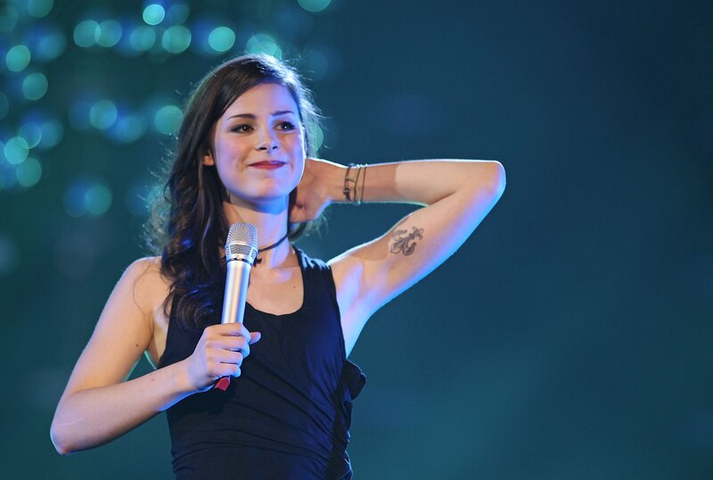 woman singing on stage