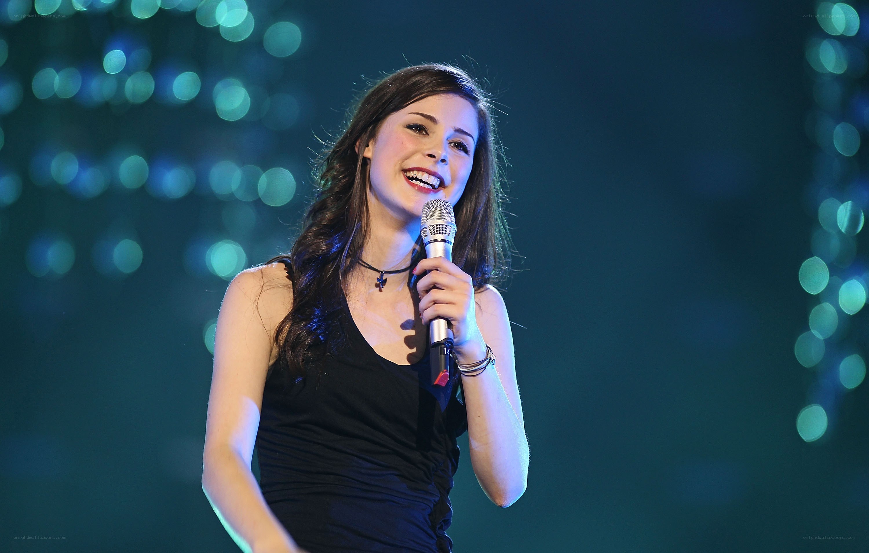 woman singing on stage