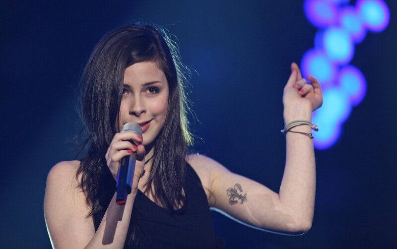 woman singing on stage