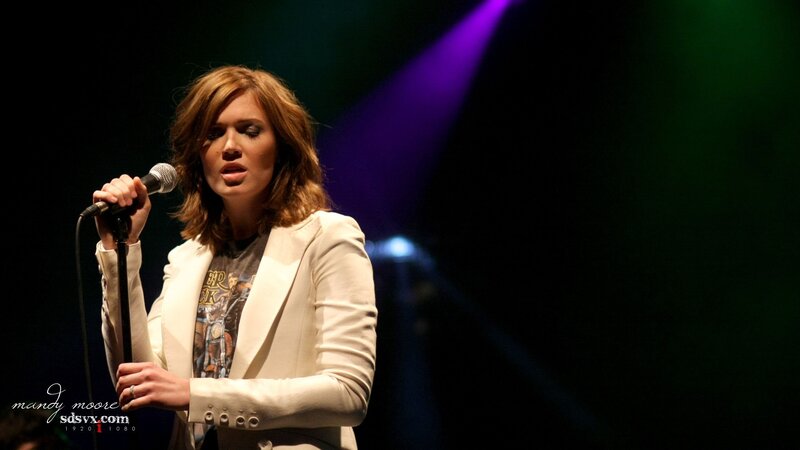 woman singing on stage