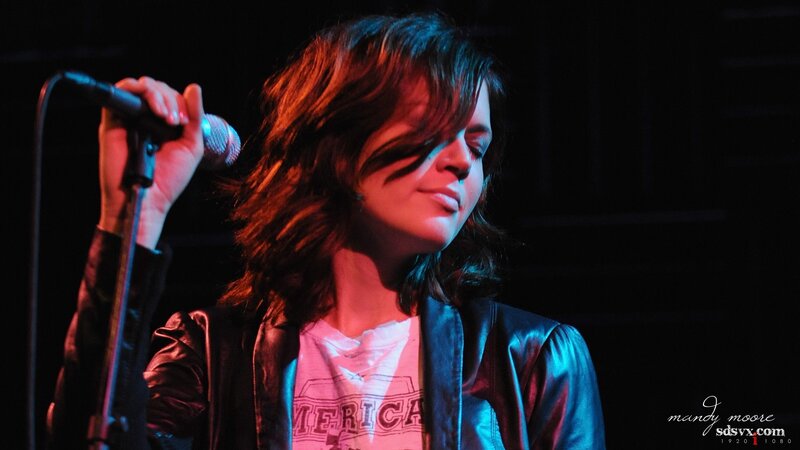 woman singing on stage