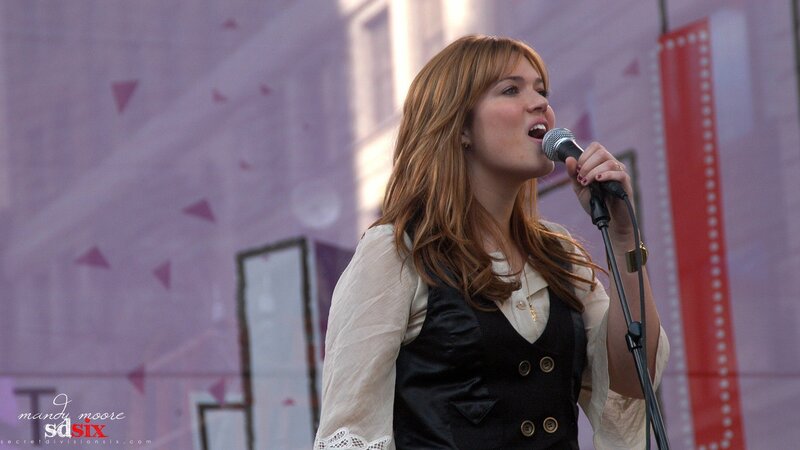 woman singing on stage