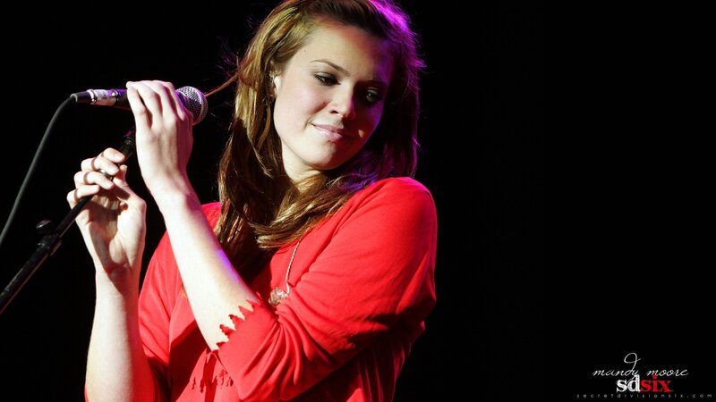 woman singing on stage