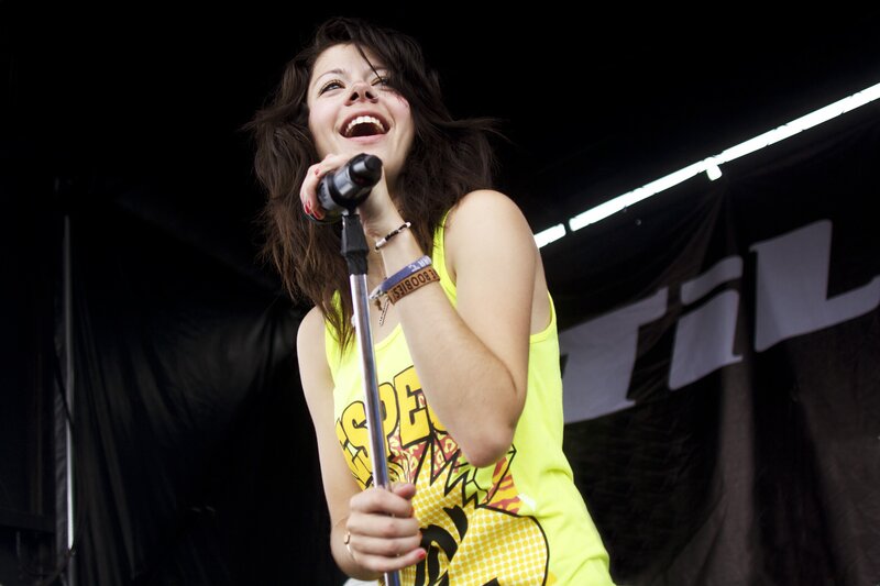 woman singing on stage