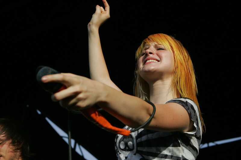 woman singing on stage
