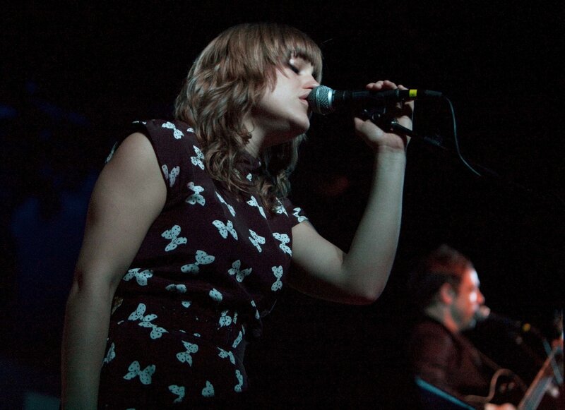 woman singing on stage