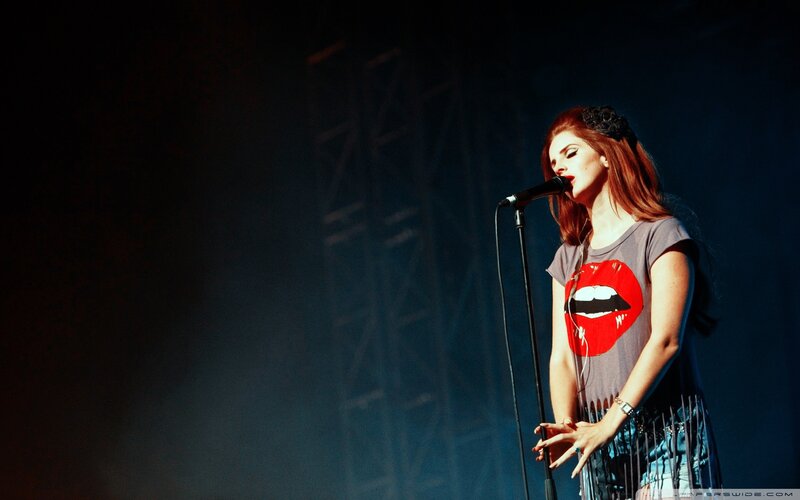 woman singing on stage