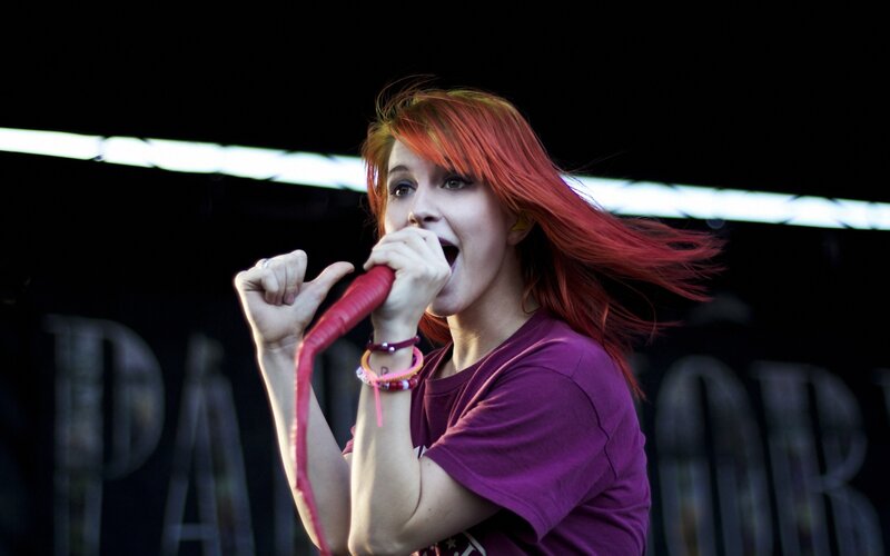 woman singing on stage