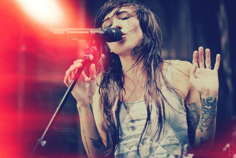 woman singing on stage