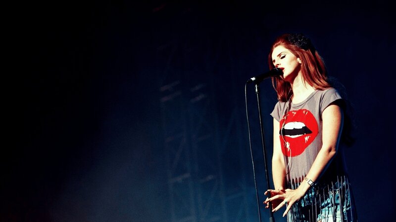 woman singing on stage