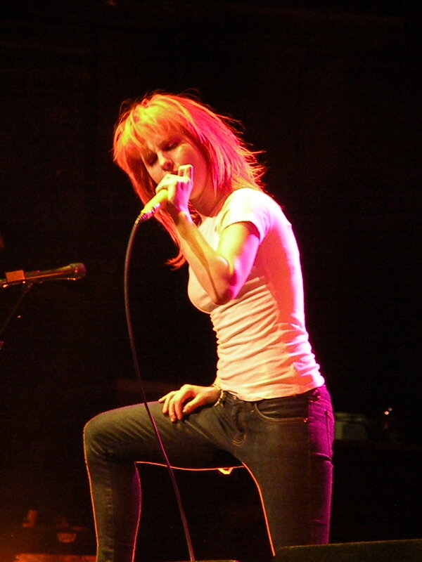 woman singing on stage