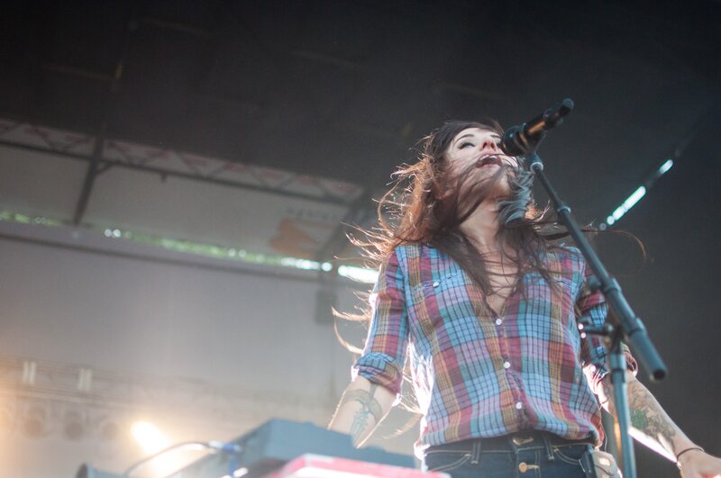 woman singing on stage