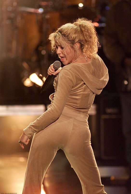 woman singing on stage