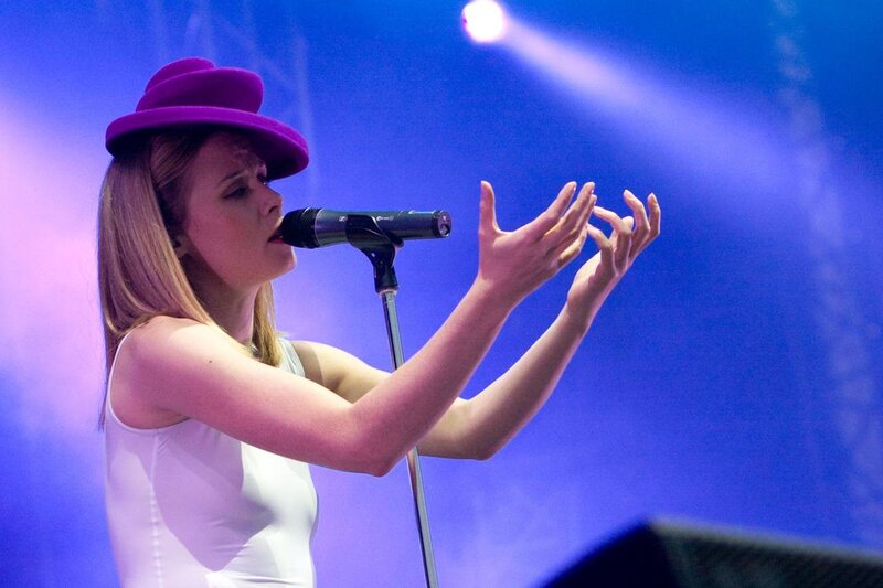 Woman singing on stage