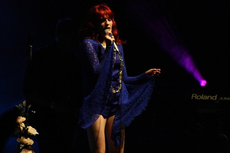 Woman singing on stage