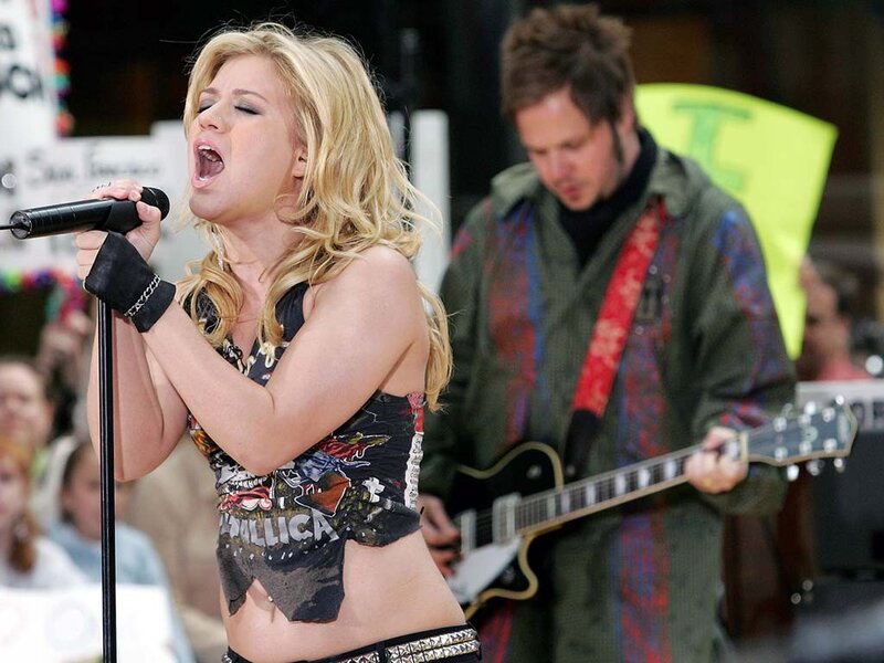 woman singing on stage