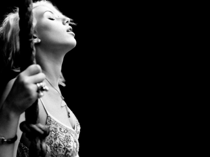 woman singing on stage