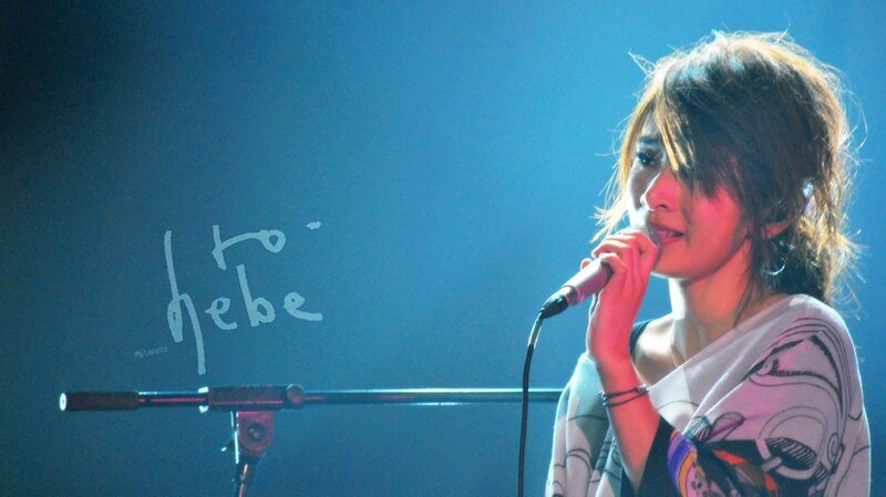 woman singing on stage