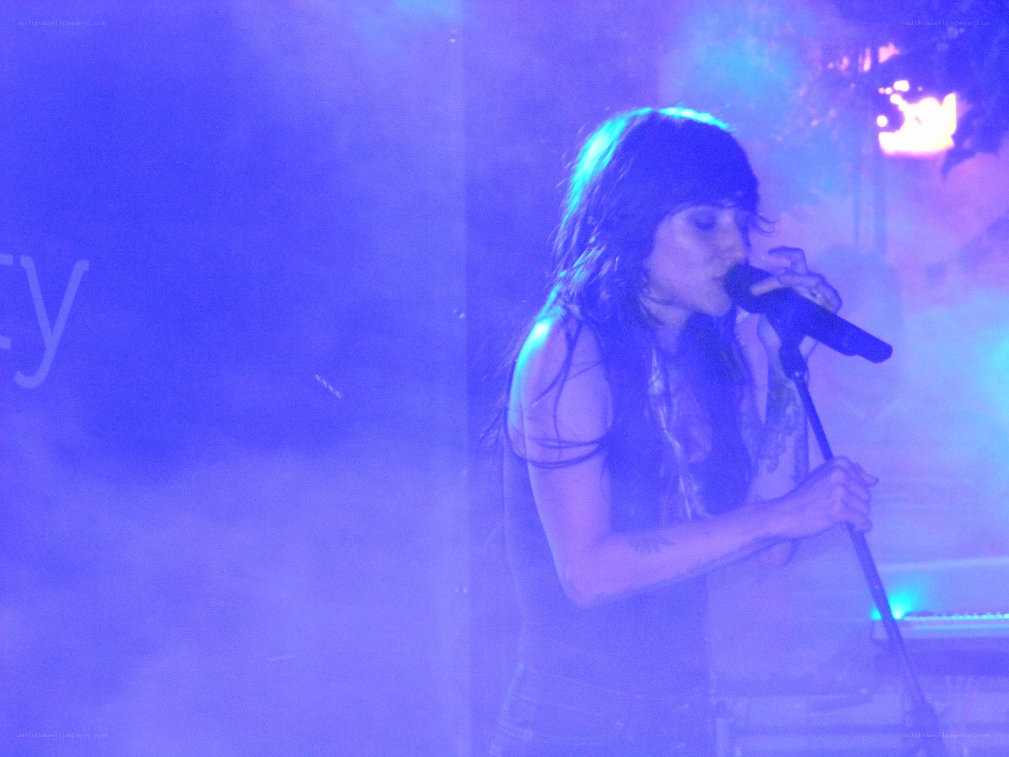 woman singing on stage