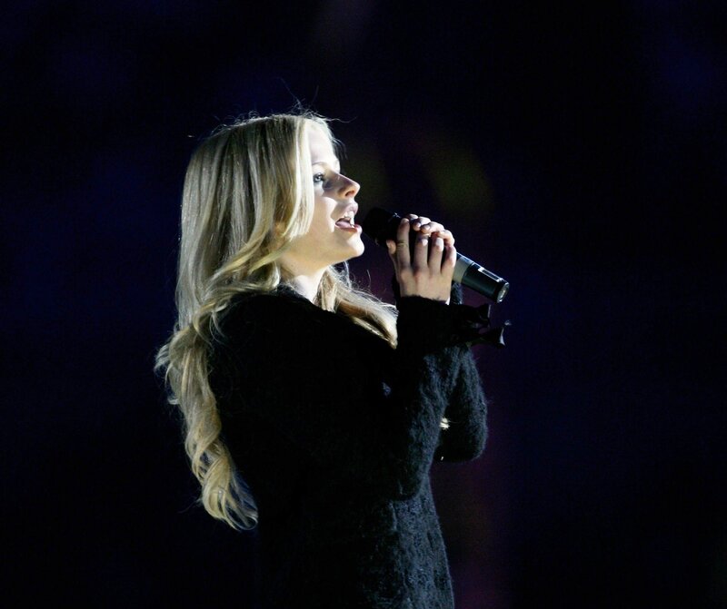 woman singing on stage