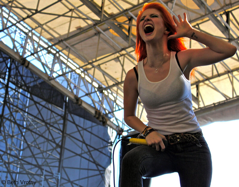 woman singing on stage