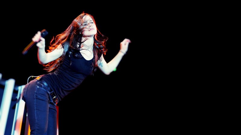 woman singing on stage
