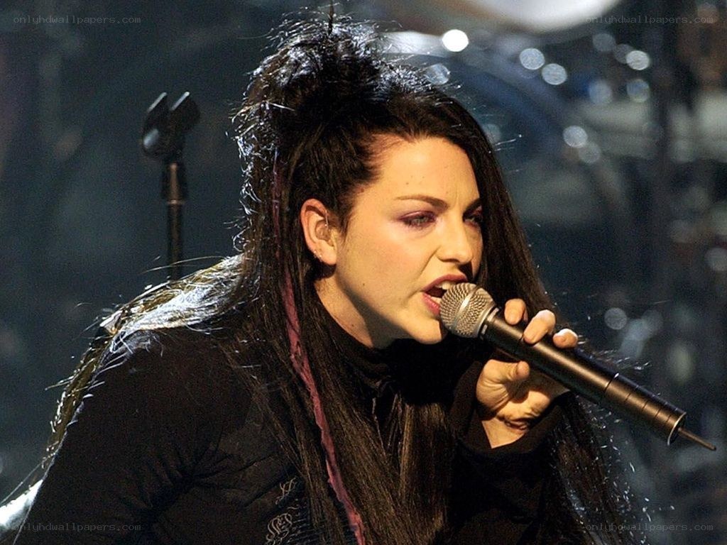 woman singing on stage