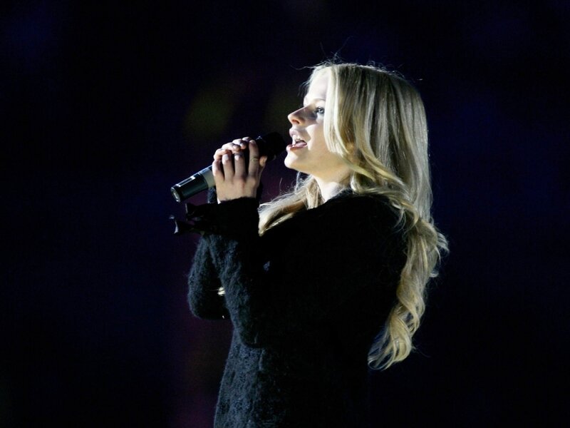 woman singing on stage