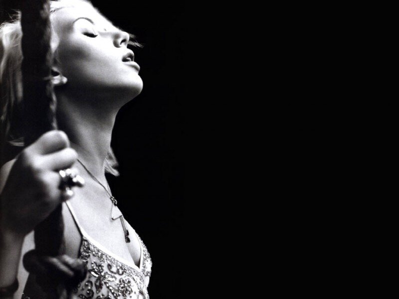 woman singing on stage