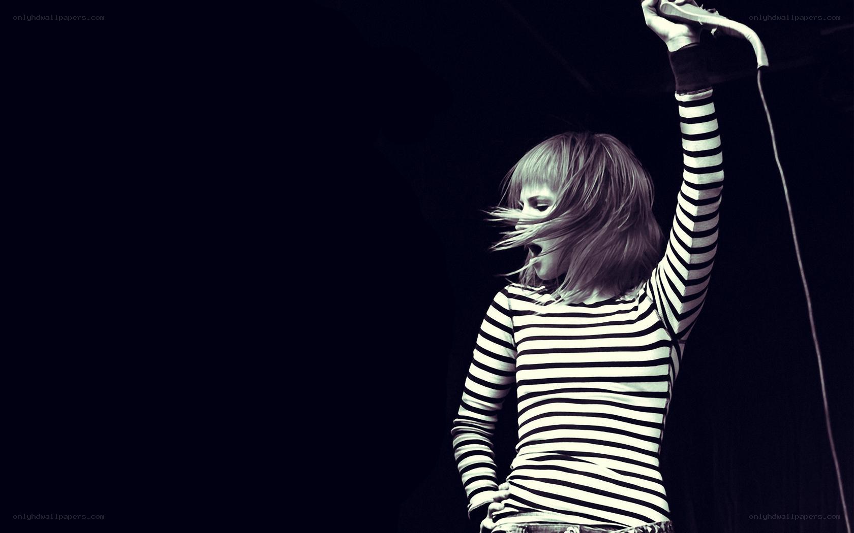 woman singing on stage