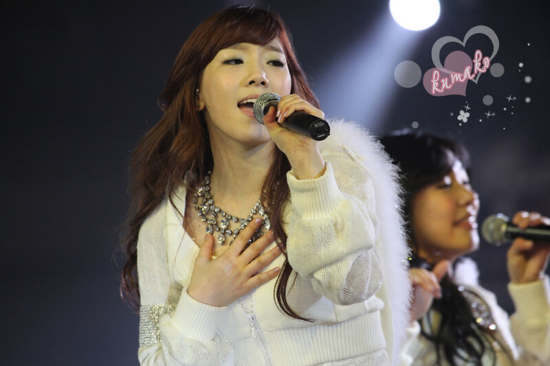 woman singing on stage