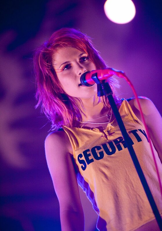 woman singing on stage
