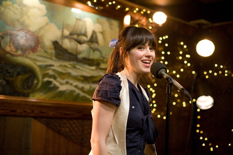 woman singing on stage