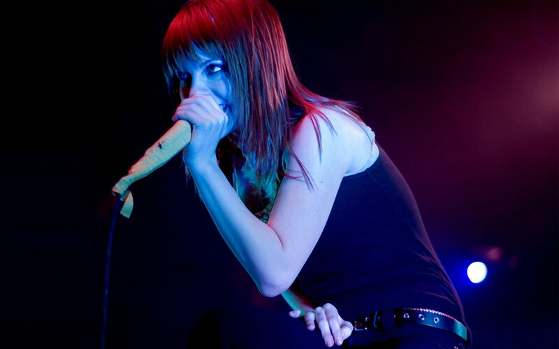 woman singing on stage