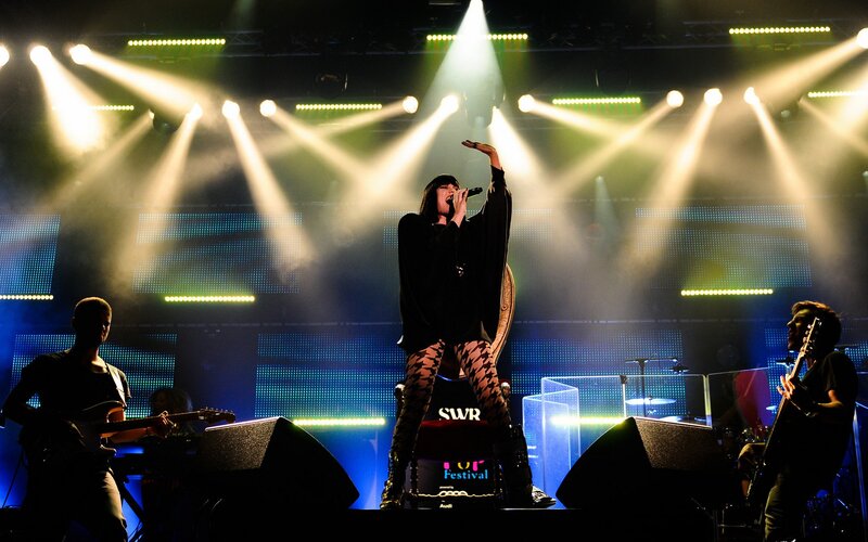 Woman Singing on Stage — Black, Dramatic, Night, Photograph, Band Members