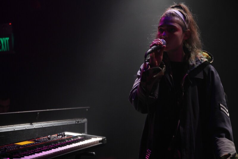 Woman Singing on Stage — Black, Dramatic, Night, Photograph, Keyboard