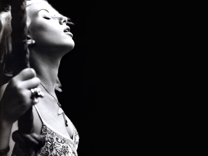 Woman Singing on Stage — Black, Dramatic, Night, Photograph, Microphone, Necklace