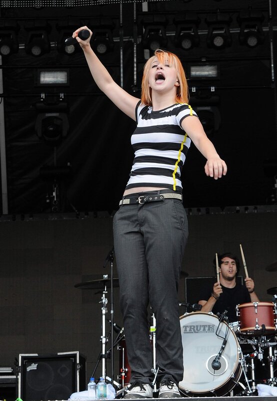 Woman Singing on Stage — Black, Energetic, Afternoon, Photograph, Drummer, Microphone