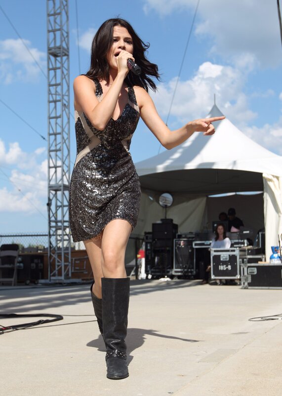 Woman Singing on Stage — Black, Energetic, Afternoon, Photograph, Microphone, Tent