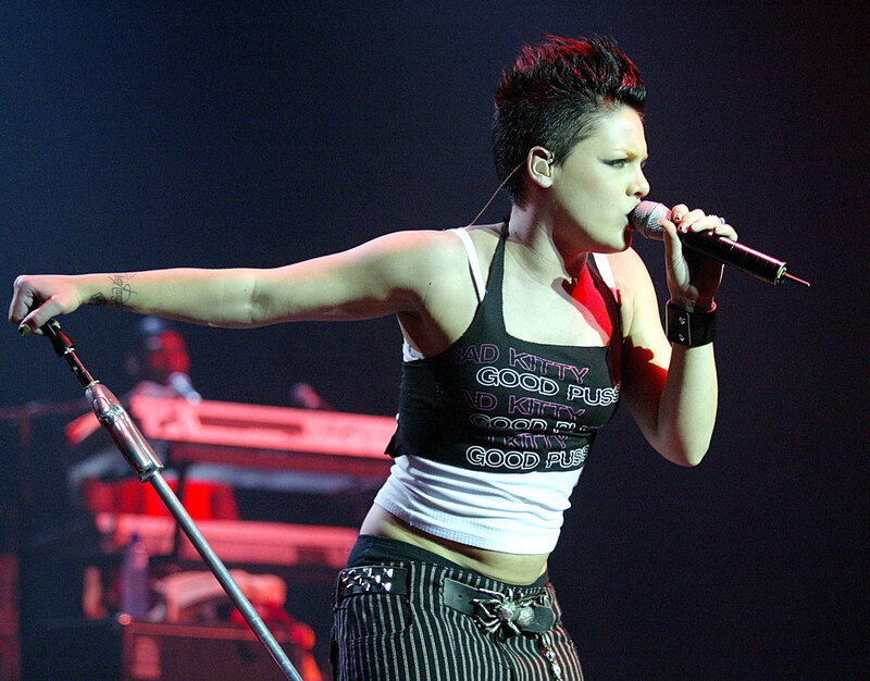 Woman Singing on Stage — Black, Energetic, Night, Photograph, Microphone, Keyboard