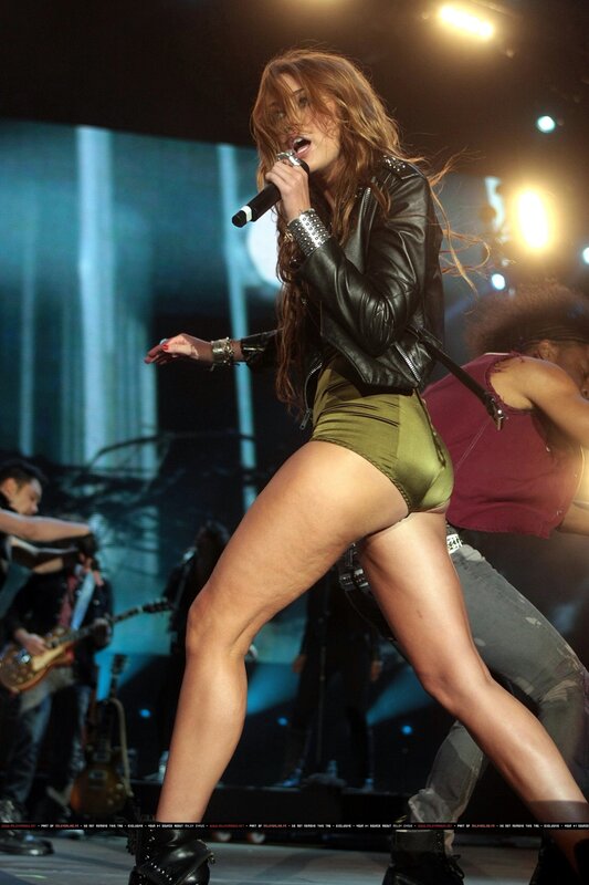 Woman Singing on Stage — Black, Energetic, Night, Photograph, Microphone, Leather Jacket, Band