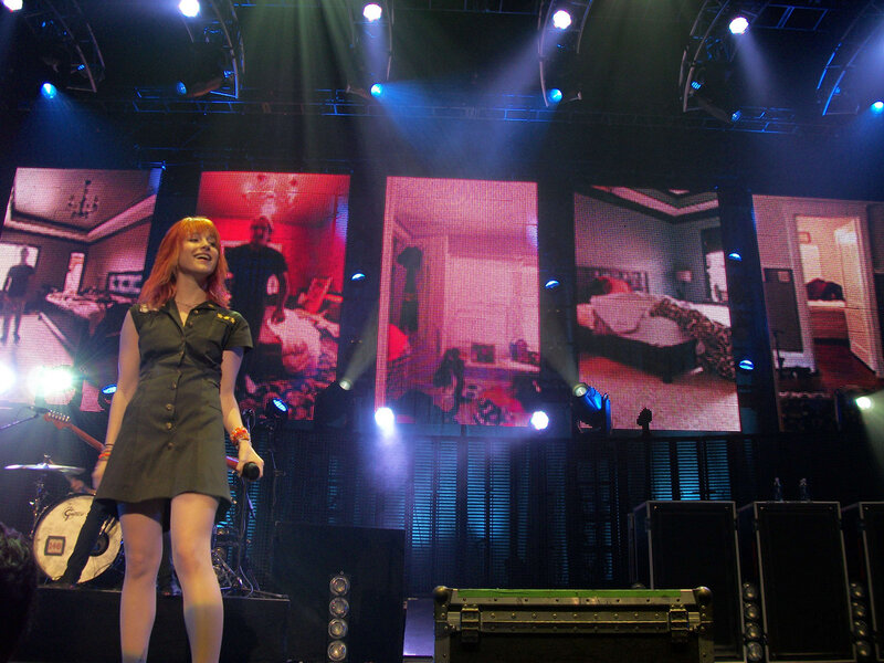 Woman Singing on Stage — Black, Energetic, Night, Photograph, Microphone