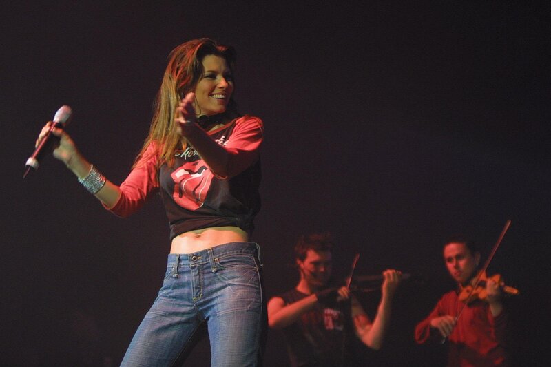 Woman Singing on Stage — Black, Energetic, Night, Photograph, Microphone, Violinists