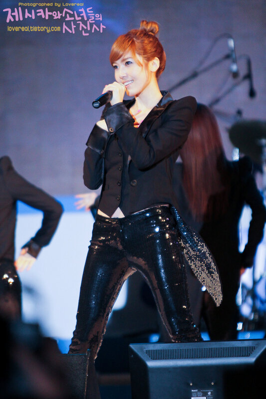 Woman Singing on Stage — Black, Energetic, Photograph, Microphone, Sequined Pants
