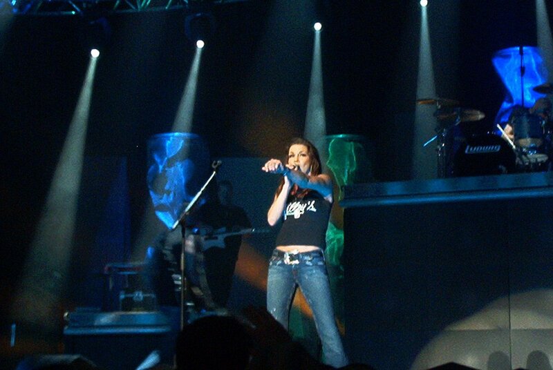 Woman Singing on Stage — Blue, Dramatic