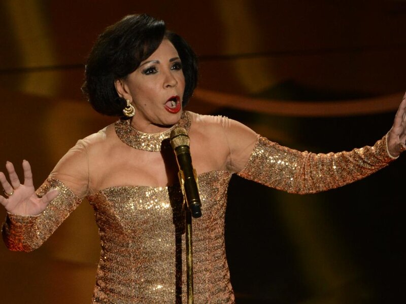 Woman Singing on Stage — Gold, Dramatic